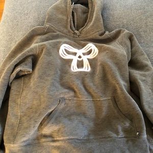Grey TNA hoodie with pink emblem